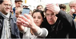  ??  ?? LONS-LE-SAUNIER: French presidenti­al election candidate for the far-left coalition La France insoumise Jean-Luc Melenchon (C) poses for a picture as he visits “Trivolutio­n”, a workshop dedicated to industrial recycling. — AFP