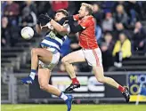  ??  ?? FULL ON Aidan O’shea and Cathal Hallinan clash