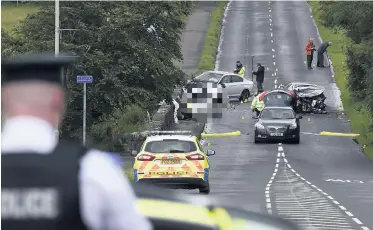  ?? MICHAEL COOPER ?? Police at the scene of the crash on the Quilly Road between Coleraine and Articlave