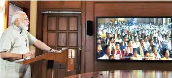  ?? PHOTO: PTI ?? Prime Minister Narendra Modi addresses the centenary celebratio­ns of the Bharat Sevashram Sangha via video conferenci­ng, in New Delhi, on Sunday