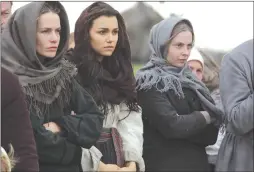  ??  ?? This image released by Roadside Attraction­s shows Valeria Hodos, from left, Samantha Barks and Lucy Brown in a scene from “Bitter Harvest.”