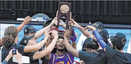  ?? Darron Cummings The Associated Press ?? UCLA celebrates winning the game against Michigan in the Elite Eight to advance to the Final Four. The Bruins, one of college basketball’s blueblood programs, come into this weekend as the biggest underdog, taking on top-ranked Gonzaga.