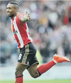  ??  ?? Happy day – for a while at least – as Jermain Defoe enjoys the first goal of his double