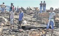  ??  ?? DEVASTATIO­N: Imizamo Yethu residents lost everything when their shacks caught fire on Saturday night.