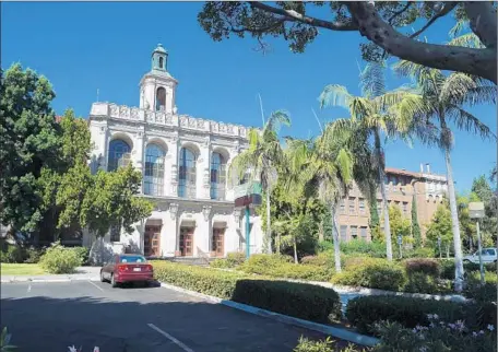  ?? Mark Ralston
AFP/Getty Images ?? IN 2011, Hamilton High School in Los Angeles was used in the porn film “Revenge of the Petites.” The L.A. Unified School District was misled about what the film company wanted to do and later issued a cease-and-desist letter, banning it from district...