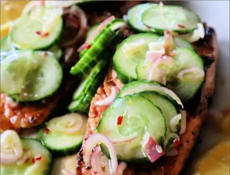  ?? Gretchen McKay/Post-Gazette ?? Heart-healthy salmon and cucumber salad are Memorial Day favorites for Chef Todd Cassell, a former Marine.