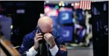  ?? RICHARD DREW — THE ASSOCIATED PRESS ?? A trader talks on his phone on the floor of the New York Stock Exchange, Wednesday.