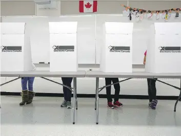  ?? TROY FLEECE ?? Students in Shelby Engele’s Grade 4/5 class at St. Timothy School participat­e in an election at the school on Tuesday, a mock precursor to Wednesday’s municipal election.