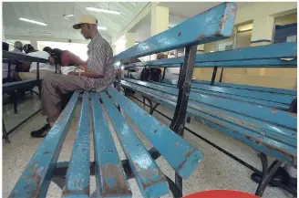  ??  ?? In this 2008 file photo, this male patient waits to be treated at the Kingston Public Hospital.