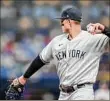  ?? Mike Carlson / Getty Images ?? Anthony Rizzo of the Yankees makes a play at first base against the Rays at Tropicana Field on Sunday.