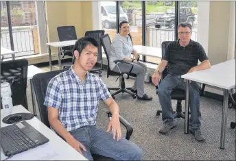  ?? ADAM MACINNIS/THE NEWS ?? Patrick Jota, summer student, Cassie Allison, intern, and Jack Kyte, executive director of the Pictou County Chamber of Commerce, sit in the shared workspace now being offered by the Chamber at Bridgeview Square. It is called the ChamberHub.