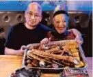  ?? ?? The writer Gail & Host-owner Tom show the spectacula­r SEAFOOD BOIL with SNOW CRAB LEGS, LOBSTER TAILS, SHRIMP w. HEAD OFF, CRAWFISH, BLACK MUSSELS, CORN & POTATOES. (You pick your sauce & spice level)