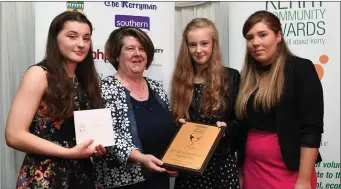  ??  ?? Bernadette Randles, from the Dromhall Hotel presenting Rathmore Social Action Group with their award