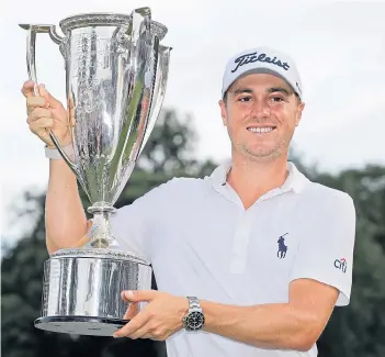  ??  ?? Justin Thomas held his nerve to clinch victory at the BMW Championsh­ip in Medinah by three shots. He held off compatriot Patrick Cantlay and Japan’s Hideki Matsuyama.