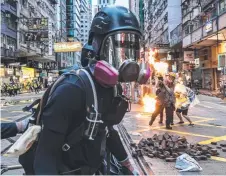  ?? Picture: GETTY IMAGES ?? Members of the media were hit by a molotov cocktail at a clash between protesters and police in Hong Kong.