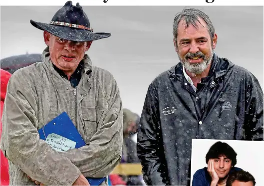  ??  ?? Drenched: Martin Clunes and Neil Morrissey wrap up in the rain at Buckham Fair