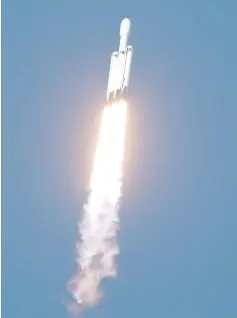  ??  ?? A SpaceX Falcon Heavy rocket, carrying the Arabsat 6A communicat­ions satellite, lifts off from the Kennedy Space Center in Cape Canaveral. — Reuters photo