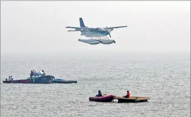  ?? REUTERS ?? An amphibious seaplane from Japan’s Setouchi Holdings prepares to land in the Arabian Sea as part of a demonstrat­ion by low-cost carrier SpiceJet in Mumbai, on Saturday.