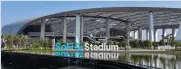  ?? ?? Above: SoFi Stadium. Below: Platinum Transporta­tion Group offers its clients private jet pickup and motorcade services in a luxury SUV.