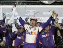  ?? JOHN RAOUX — THE ASSOCIATED PRESS ?? Denny Hamlin celebrates in Victory Lane after winning the NASCAR Daytona 500 auto race at Daytona Internatio­nal Speedway, Sunday in Daytona Beach, Fla.