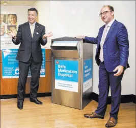  ?? Benjamin Hager ?? Las Vegas Review-journal @benjaminhp­hoto Gov. Brian Sandoval, left, and Richard Ashworth, president of operations for Walgreens, celebrate the opening of the drugstore chain’s 1,000th safe medication disposal kiosk at a Walgreens in Las Vegas on Monday.