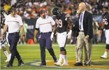  ?? Jonathan Daniel / Getty Images ?? Chicago linebacker Lamarr Houston leaves the game with a knee injury in the first half of a loss to Philadelph­ia.