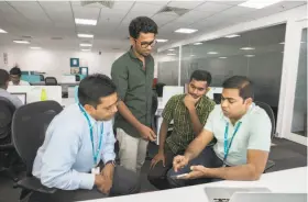  ?? Samyukta Lakshmi / New York Times ?? Mobicip CEO Suren Ramasubbu (left) discusses his now-banned app with colleagues in Bengaluru, India. Apple has also dumped OurPact, below.