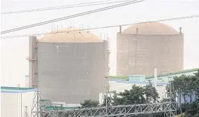  ??  ?? South Korea’s oldest nuclear reactor, the 40-year-old Kori No.1 (right), halted operations in mid-June, becoming the country’s first nuclear plant to close permanentl­y amid plans for a shift toward natural gas and renewables.