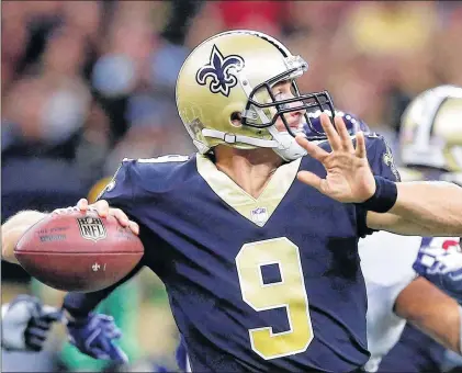  ?? AP PHOTO ?? In this Aug. 26 file photo, New Orleans Saints quarterbac­k Drew Brees drops back to pass in the first half of a preseason NFL game against the Houston Texans in New Orleans.