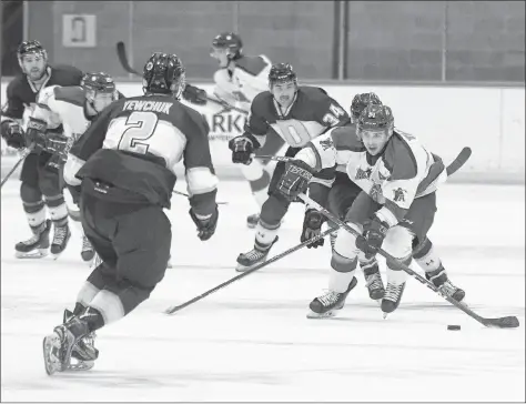  ?? PETER OLESKEVICH ?? Kyle Farrell breaks out of the Axemen’s end against Dalhousie.