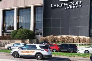  ?? ?? Emergency vehicles line the feeder road outside Lakewood Church during an active shooter event Sunday in Houston. (Kirk Sides/houston Chronicle via AP)