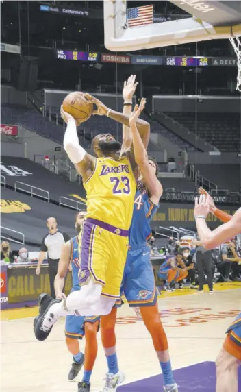  ?? (Photo: AFP) ?? Lebron James (left) of the Los Angeles Lakers shoots the ball during the game against the Oklahoma City Thunder at STAPLES Center in Los Angeles, California, on Wednesday.