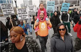  ?? Alex Slitz/Associated Press ?? Demonstrat­ors march during a protest Saturday in Atlanta over the death of Tyre Nichols, who died after being beaten by Memphis police. Five officers were charged in the encounter.