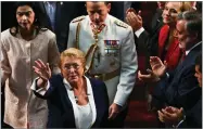  ??  ?? Chile’s outgoing President Michelle Bachelet waves after the swearing-in ceremony for Sebastian Pinera at Congress in Valparaiso, Chile, Sunday, March 11.