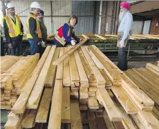  ?? ARLEN REDEKOP ?? B.C. Liberal Leader Christy Clark, seen visiting Partap Forest Products in Maple Ridge on Tuesday, says the province will fight new measures imposed on lumber by the U.S., “and we will win.”