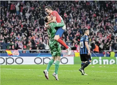  ?? Picture: DAVID RAMOS/GETTY IMAGES ?? SHEER DELIGHT: Jan Oblak and Cesar Azpilicuet­a of Atletico Madrid celebrate after their victory in the penalty shoot-out during the Uefa Champions League round of 16 second leg match against Inter Milan in Madrid, Spain, on Wednesday