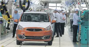  ?? SOMCHAI POOMLARD ?? Mitsubishi’s eco-cars are being assembled at its plant in Laem Chabang, Chon Buri.