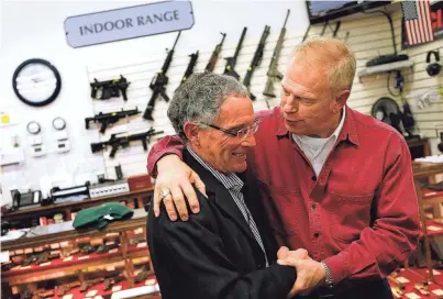  ?? BICKEL COLUMBUS DISPATCH ?? MIDDLE: Two months after the mass shooting in Dayton in 2019, Gov. Mike Dewine unveiled the STRONG Ohio bill.
JOSHUA A.
BOTTOM: Former Gov. Ted Strickland, right, and Allen Schulman talk in 2011.
JONATHAN
QUILTER/