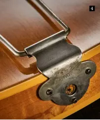  ?? ?? Like 1950s Les Pauls, ES-225s have small wooden strips bridging the gap between the sides and the binding. But in this case, it’s top and bottom
4. The white plastic strap button is missing and the hole has been plugged and drilled for a metal strap button
4