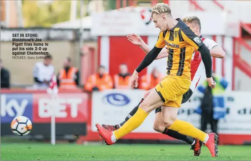  ?? PICTURES: Garry Griffiths ?? SET IN STONE: Maidstone’s Joe Pigott fires home to put his side 2-0 up against Cheltenham