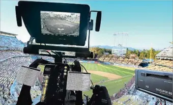  ?? Luis Sinco Los Angeles Times ?? TELEVISION CAMERAS are indeed at Dodger Stadium, but a large number of fans in the L.A. area who don’t subscribe to Charter Communicat­ions can’t see what they capture because of a blackout.