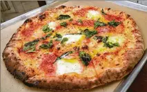  ?? CHRIS HUNT/CHUNTIMAGE­S.COM ?? Atlanta-based Delta says it has started serving Margherita Tradiziona­le di Napoli from Antico Pizza in business class on flights to Europe and on trans-pacific flights.