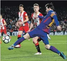  ?? ASSOCIATED PRESS FILE PHOTO ?? Lionel Messi kicks the ball during the Spanish La Liga soccer match between FC Barcelona and Girona at Camp Nou Stadium on Saturday. Barcelona leads the Spanish league.