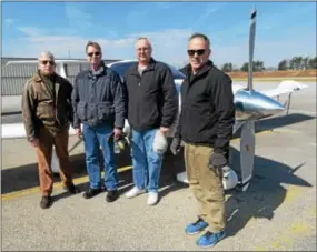  ?? PHOTOS BY PETE BANNAN – DIGITAL FIRST MEDIA ?? From left, Brandywine Flight School Chief instructor Jim Wawrzyniak, pilots David Hogue and Rick Laytham, with owner Stephen Richards on the ramp at Brandywine Airport.