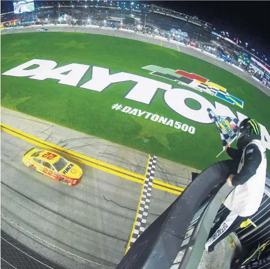  ?? JARED C. TILTON/GETTY IMAGES ?? Defending NASCAR series champion Joey Logano crosses the finish line to win the second of two duel races held Thursday ahead of this afternoon’s Daytona 500. Logano starts 4th.