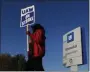  ?? PAUL SANCYA — THE ASSOCIATED PRESS ?? Yolanda Jacobs, a United Auto Workers member, walks the picket line at the General Motors Romulus Powertrain plant in Romulus, Mich., on Wednesday.