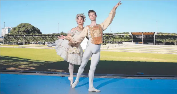  ??  ?? ON STAGE: Australian Ballet dancers Luke Marchant and Jill Ogai prepare for last year’s Coppelia performanc­e at Munro Martin Parklands in Cairns.