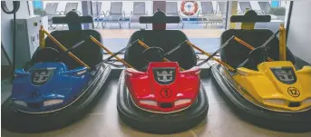  ?? JUSTIN CHIN/BLOOMBERG FILES ?? Bumper cars sit parked on board a cruise ship operated by Royal Caribbean Cruises Ltd. in Hong Kong. Royal Caribbean is nearing a 100-per-cent return thanks to retail investors.