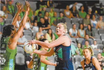  ?? Quinn Rooney / Getty Images ?? Mental health advocate Caitlin Thwaites looks to pass during the 2020 Super Netball grand final in October, the last match of her 18-year career at an elite level.