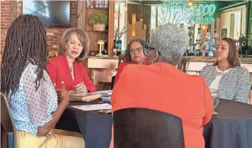  ?? AMETHYST MARTINEZ/USA TODAY NETWORK ?? From left, state Sen. Marie Pinkney, U.S. Rep. Lisa Blunt Rochester, Mini Timmaraju, Tiffany Chalk (back to camera) and Mona Liza Hamlin take part in a roundtable event on Black maternal health advocacy at Oath '84 on April 13 in Wilmington.